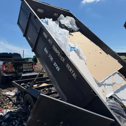 The trailer tipped up, dumping a load of drywall