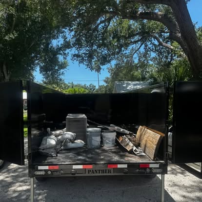 Open trailer with a small load of household items